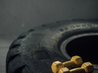 Row of heavy dumbbells in a sports club environment